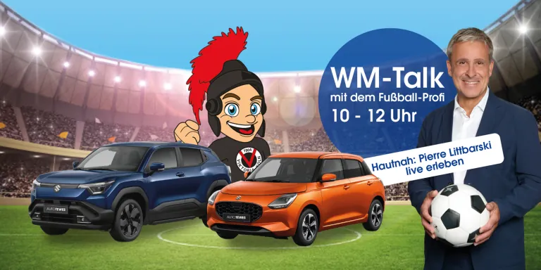 Suzuki e Vitara und Suzuki Swift in Fußball-Stadion neben Foto von Pierre Littbarski